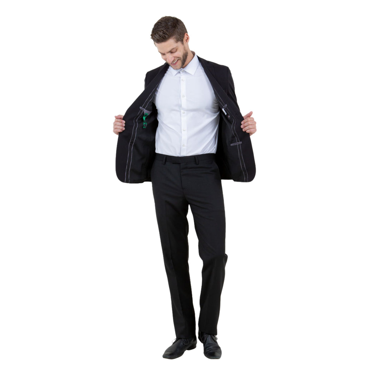 Black jacket on model opened to show the lining, with white shirt and trousers