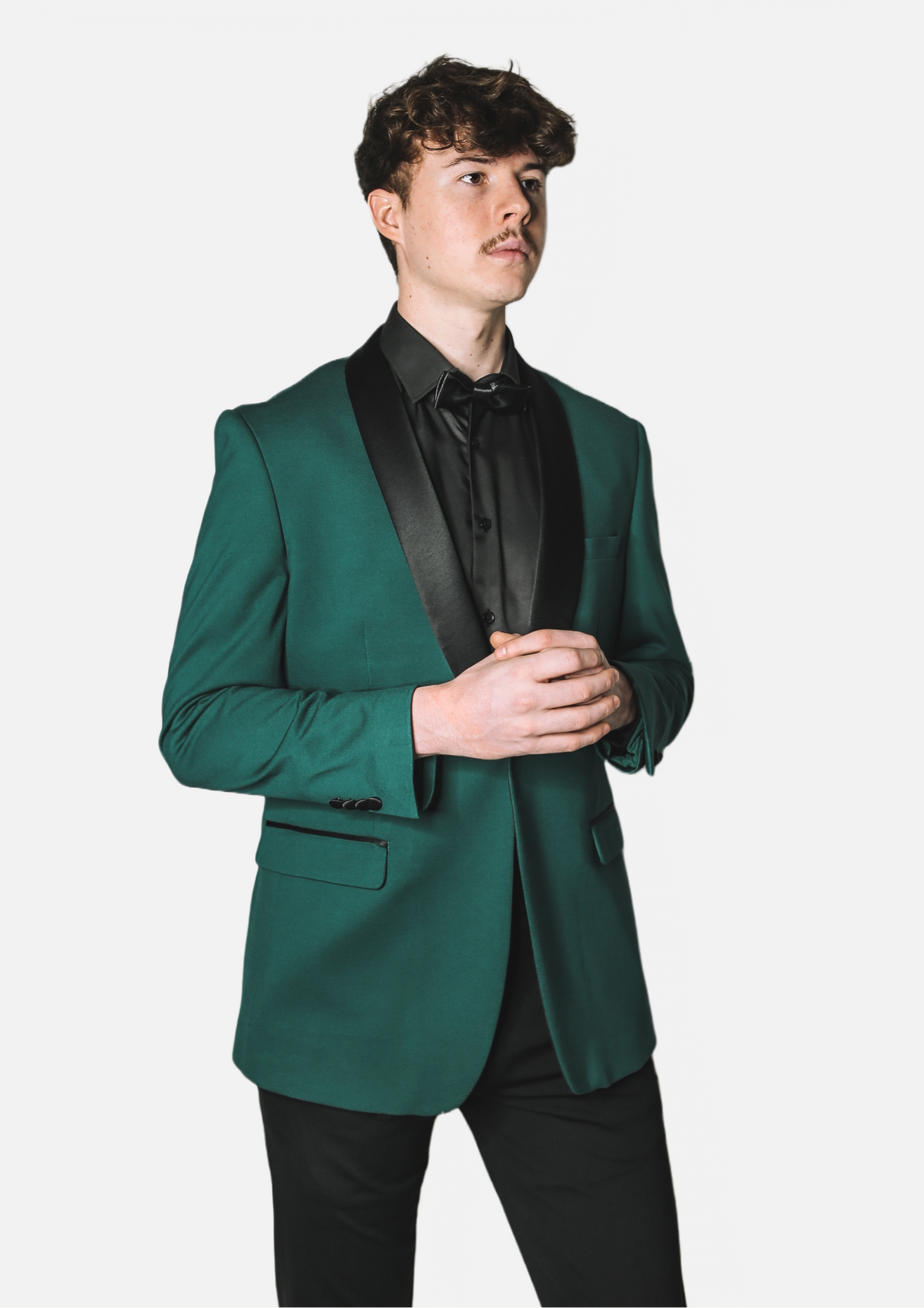 Men's Emerald Green Tuxedo Jacket with black satin shawl lapel worn on model over a black shirt, torso view