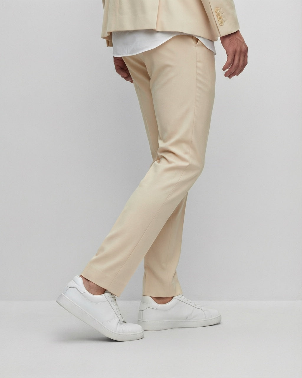 Men's Beige Tailored Stretch Suit — trouser fit and hem detail with white sneakers