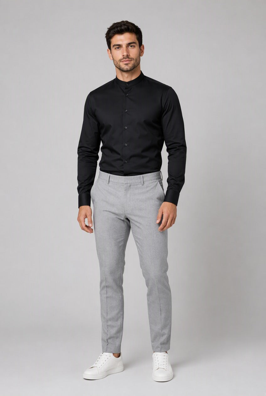 Men's Black Collarless Stretch Dress Shirt — on model buttoned to the band collar, tucked into grey trousers with white sneakers