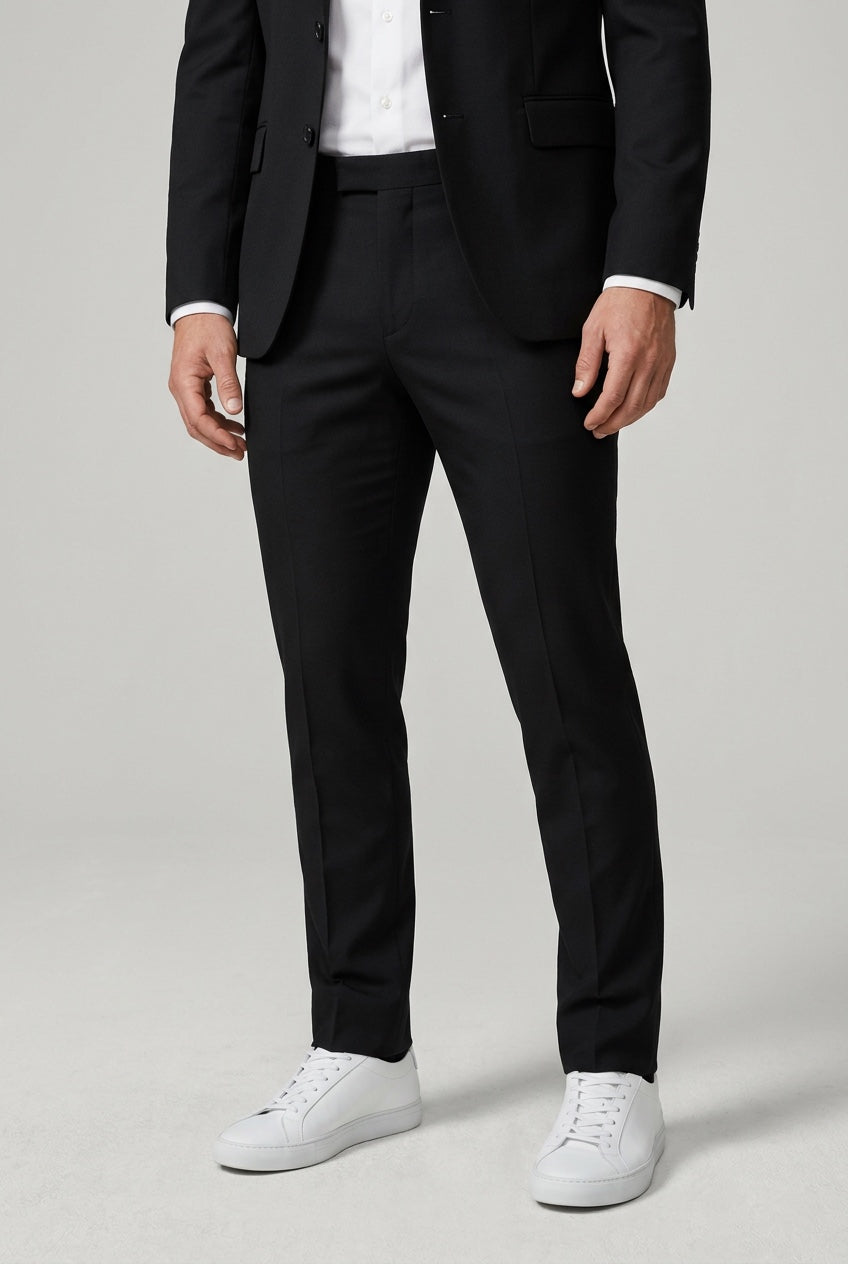 Men's Slim-Fit Black Stretch Suit — matching trousers, slim-fit leg and hem detail with white sneakers