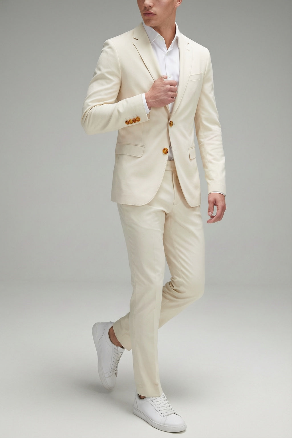 Men's Bone Motion Stretch Suit — on model with white shirt and white sneakers