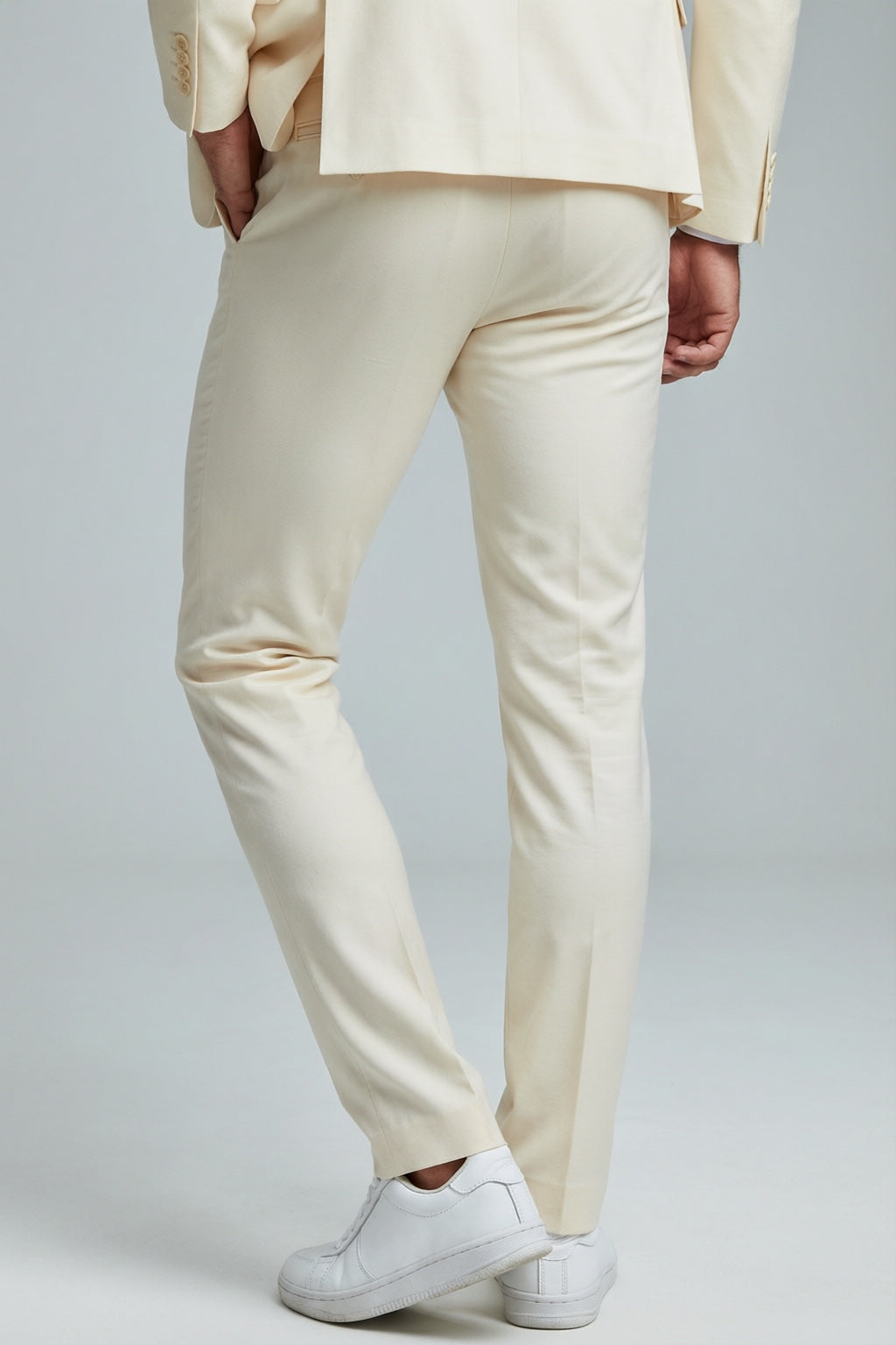 Men's Bone Motion Stretch Suit — trouser fit and hem detail with white sneakers