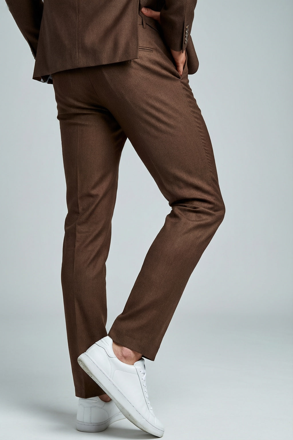 Men's Brown Motion Stretch Suit — trouser fit and hem detail with white sneakers