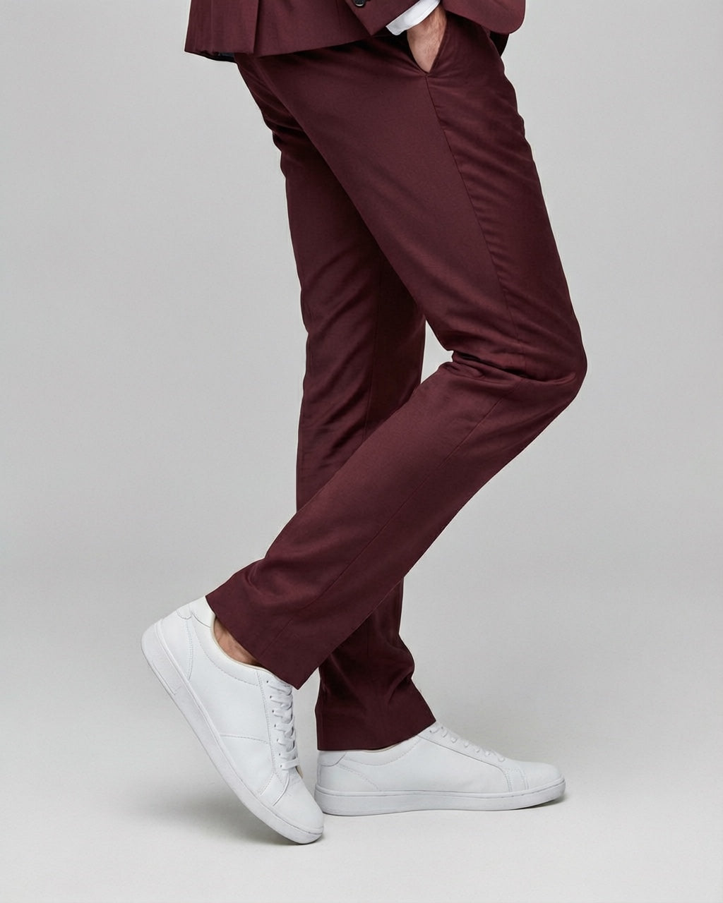 Men's Burgundy Tailored Stretch Suit — trouser fit and hem detail with white sneakers