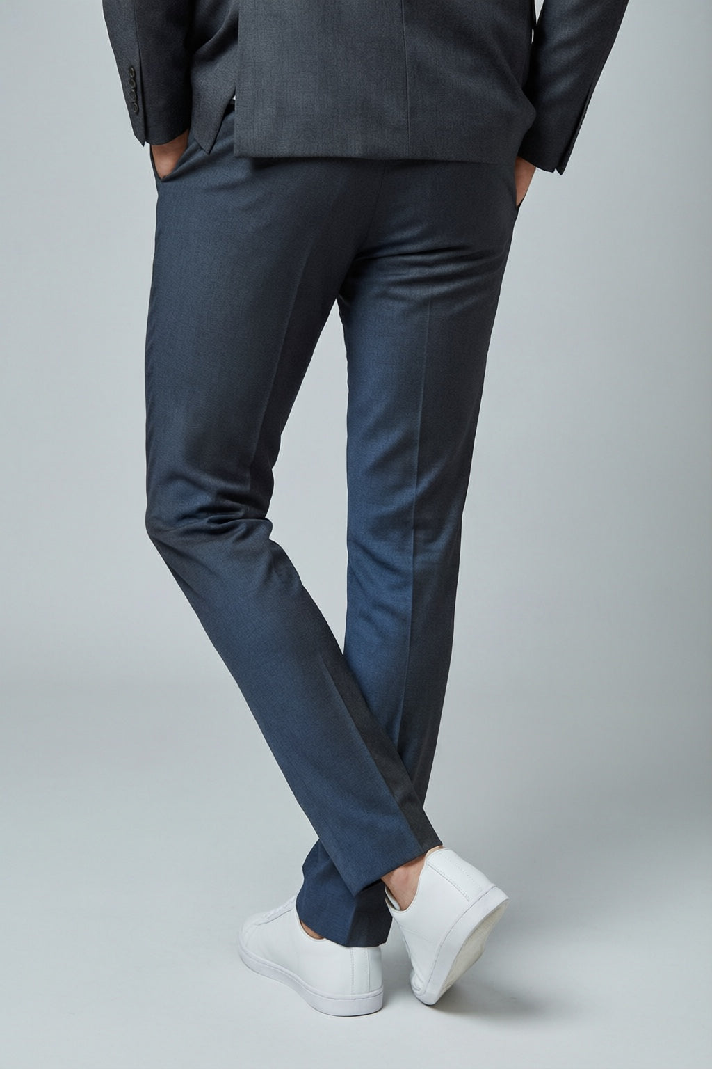 Men's Charcoal Motion Stretch Suit — trouser fit and hem detail with white sneakers