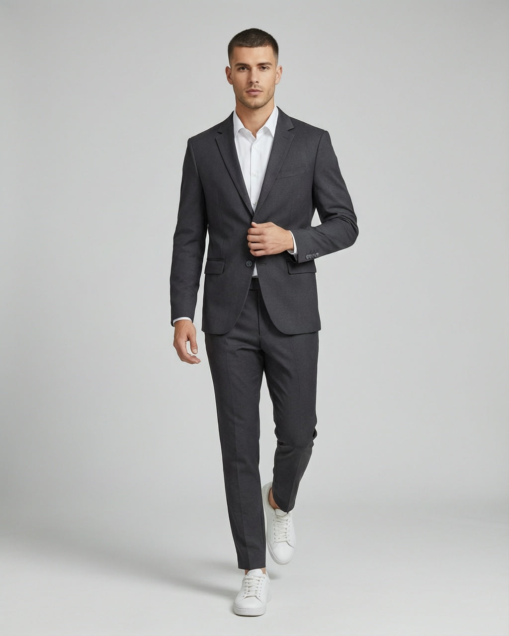 Men's Charcoal Tailored Stretch Suit — on model with white shirt and white sneakers