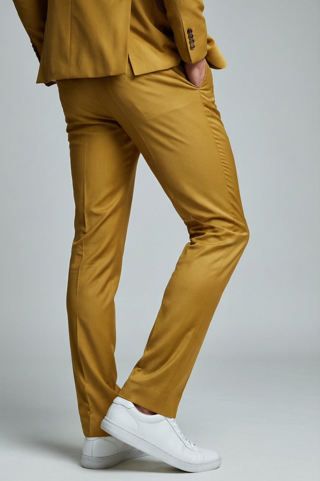 Men's Gold Motion Stretch Suit — trouser fit and hem detail with white sneakers