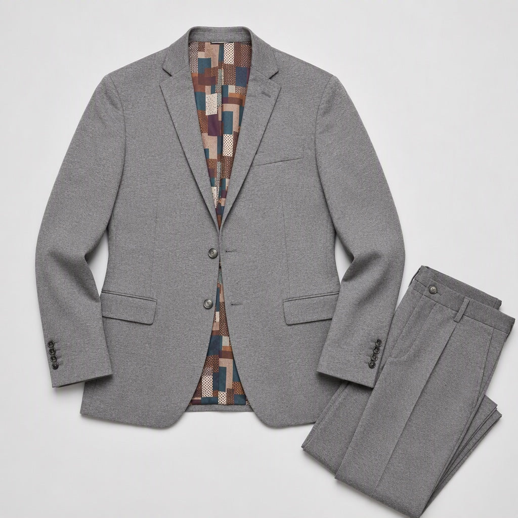 Men's Slim-Fit Heather Gray Stretch Suit laid flat, notched-lapel jacket with patchwork lining beside folded matching trousers