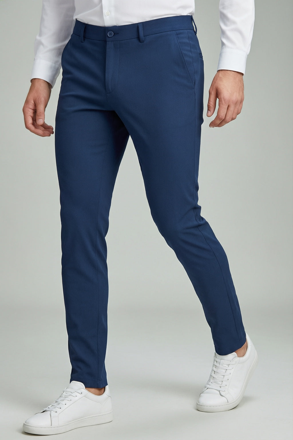 Men's Navy Motion Stretch Dress Pants — trouser fit and hem detail with white sneakers