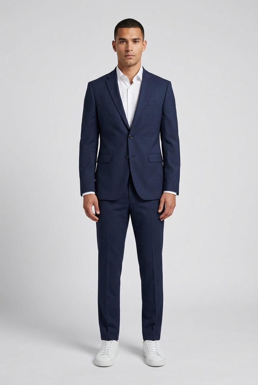 Men's Slim-Fit Navy Stretch Suit — on model with matching trousers, white shirt and white sneakers