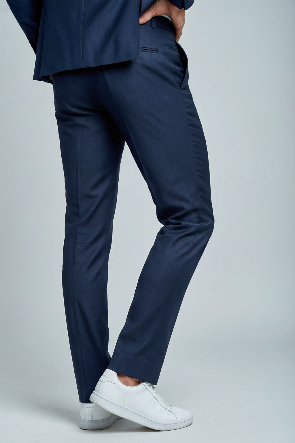 Men's Navy Tailored Stretch Suit — trouser fit and hem detail with white sneakers