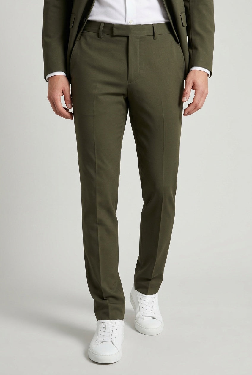 Men's Slim-Fit Stretch Olive Green Dress Pants — trousers on model, slim-fit leg and hem detail with white sneakers