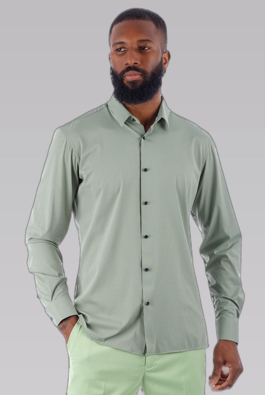 Men's Sage Stretch Dress Shirt — on model against a pale grey studio backdrop
