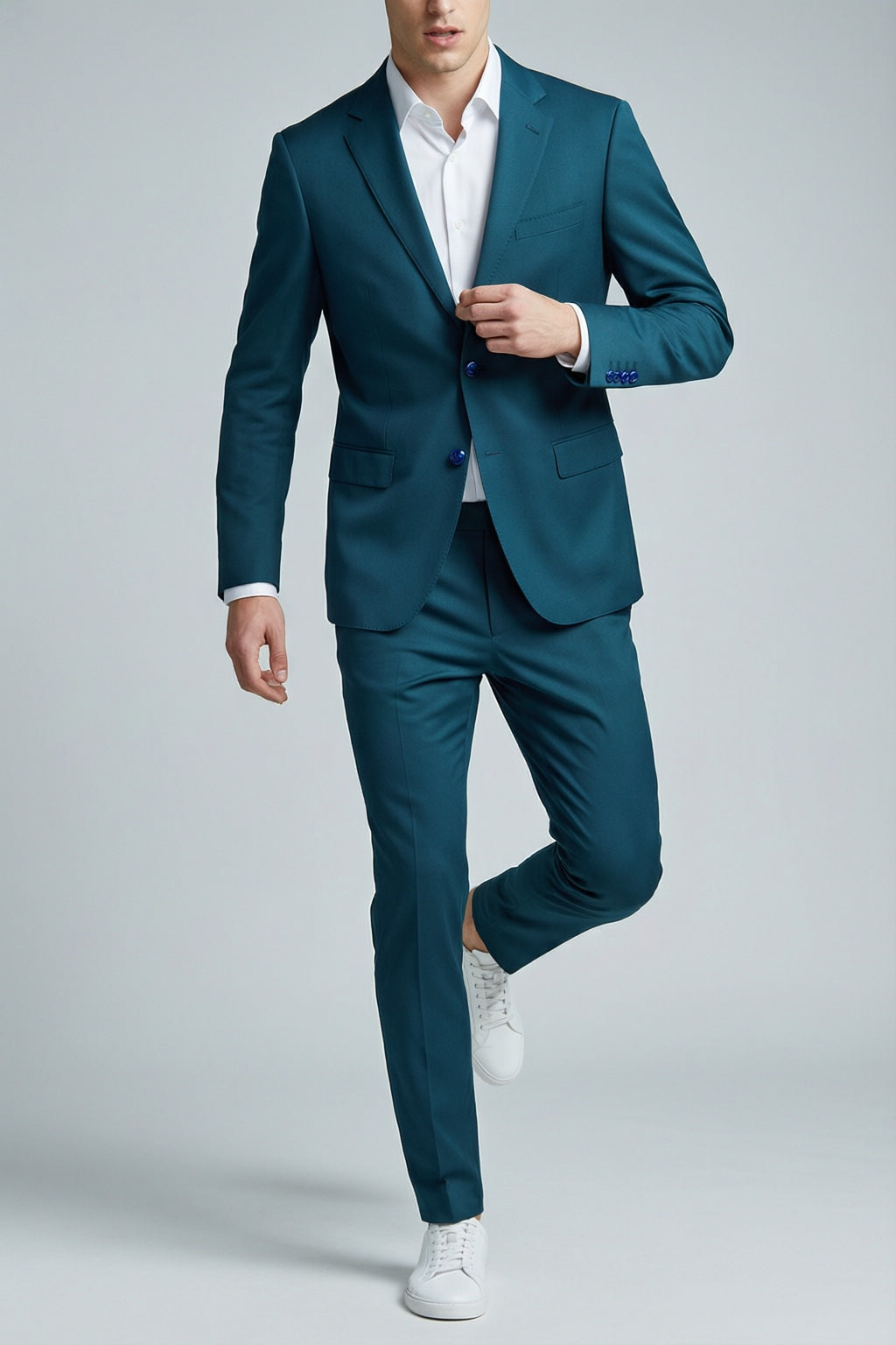 Men's Teal Motion Stretch Suit — on model with white shirt and white sneakers
