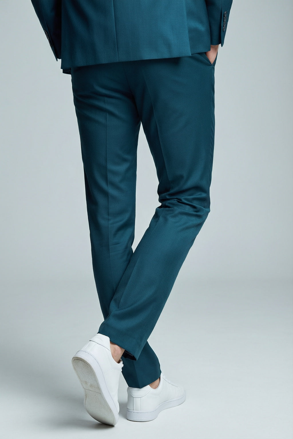 Men's Teal Motion Stretch Suit — trouser fit and hem detail with white sneakers