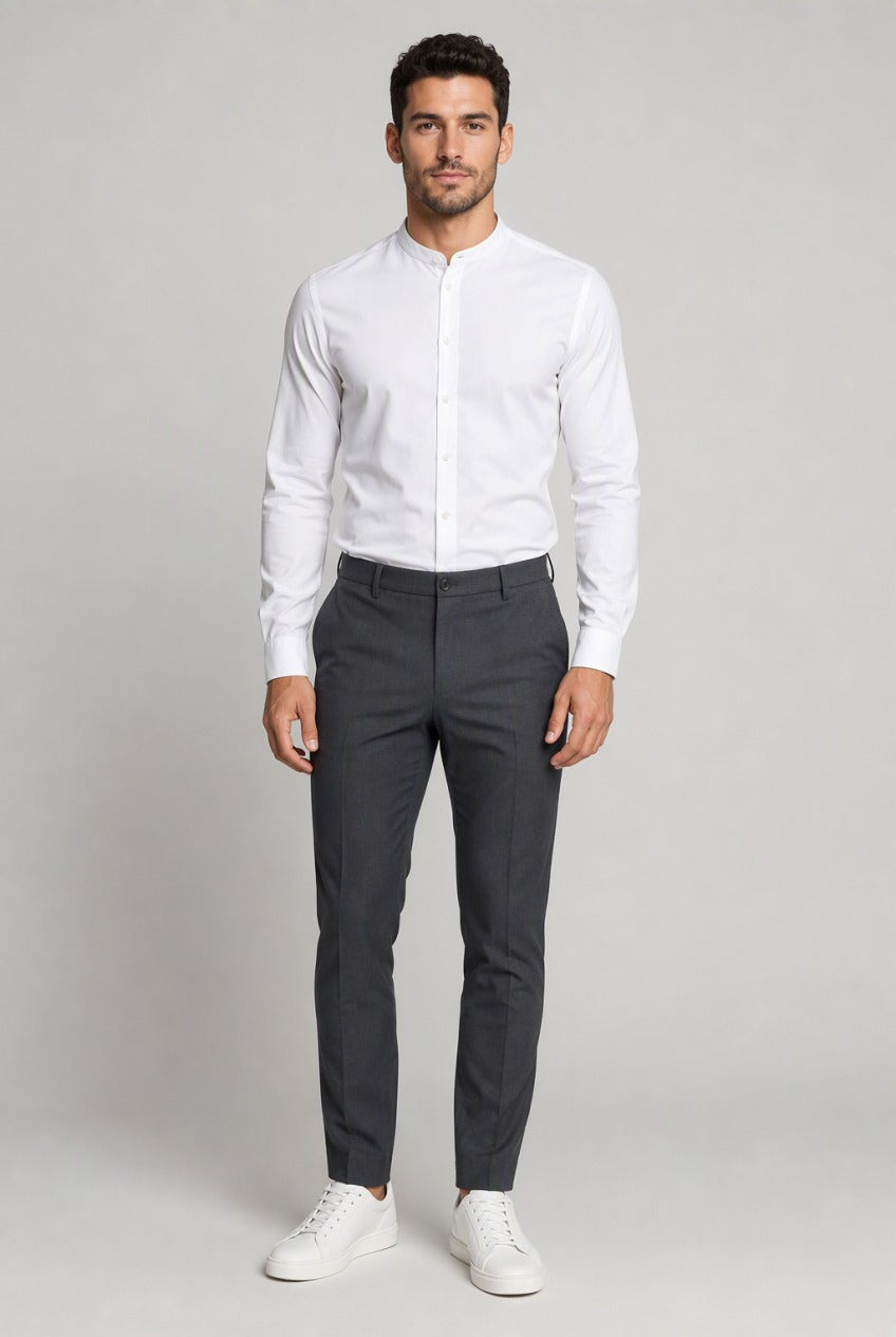 Men's White Collarless Stretch Dress Shirt — on model buttoned to the band collar, tucked into charcoal trousers with white sneakers